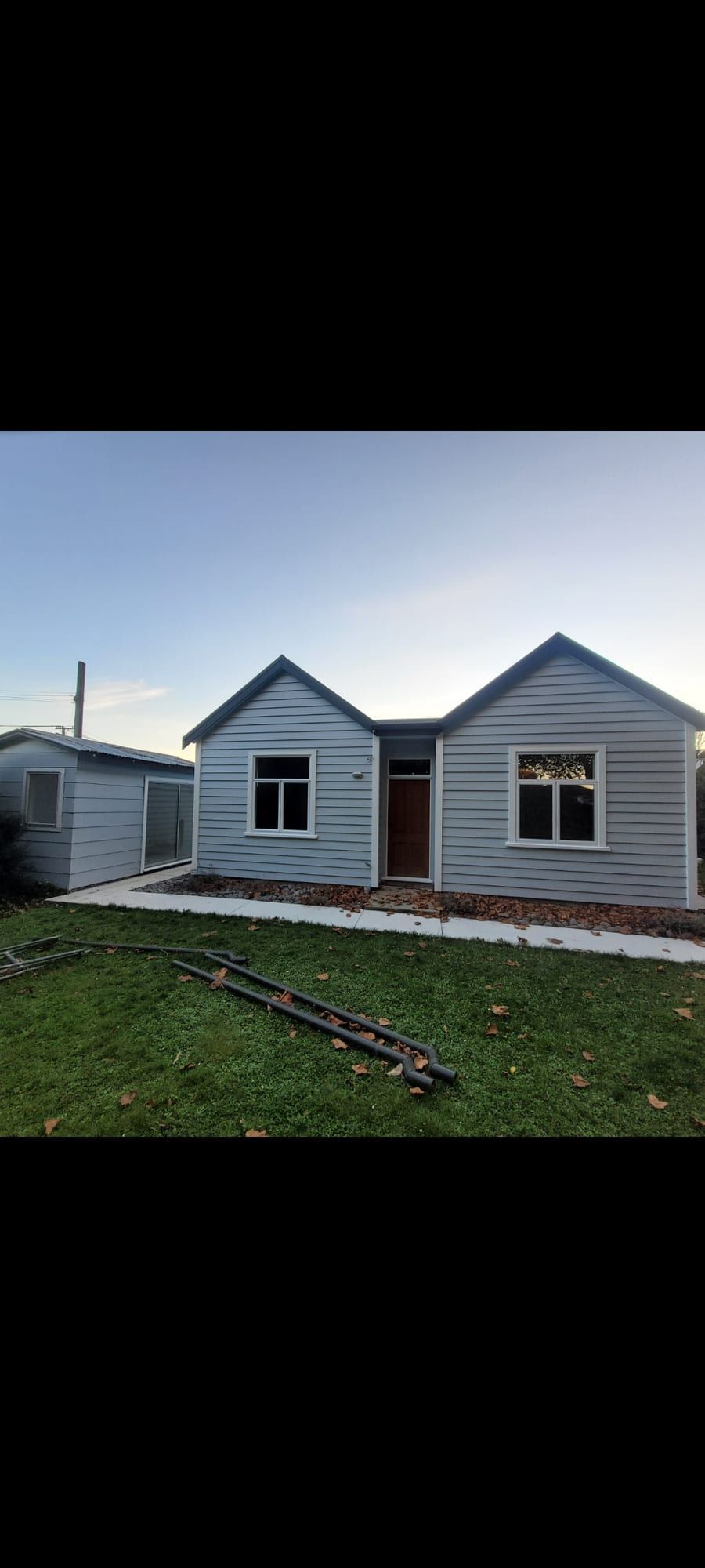 Character home repaint, cream with a dark gable