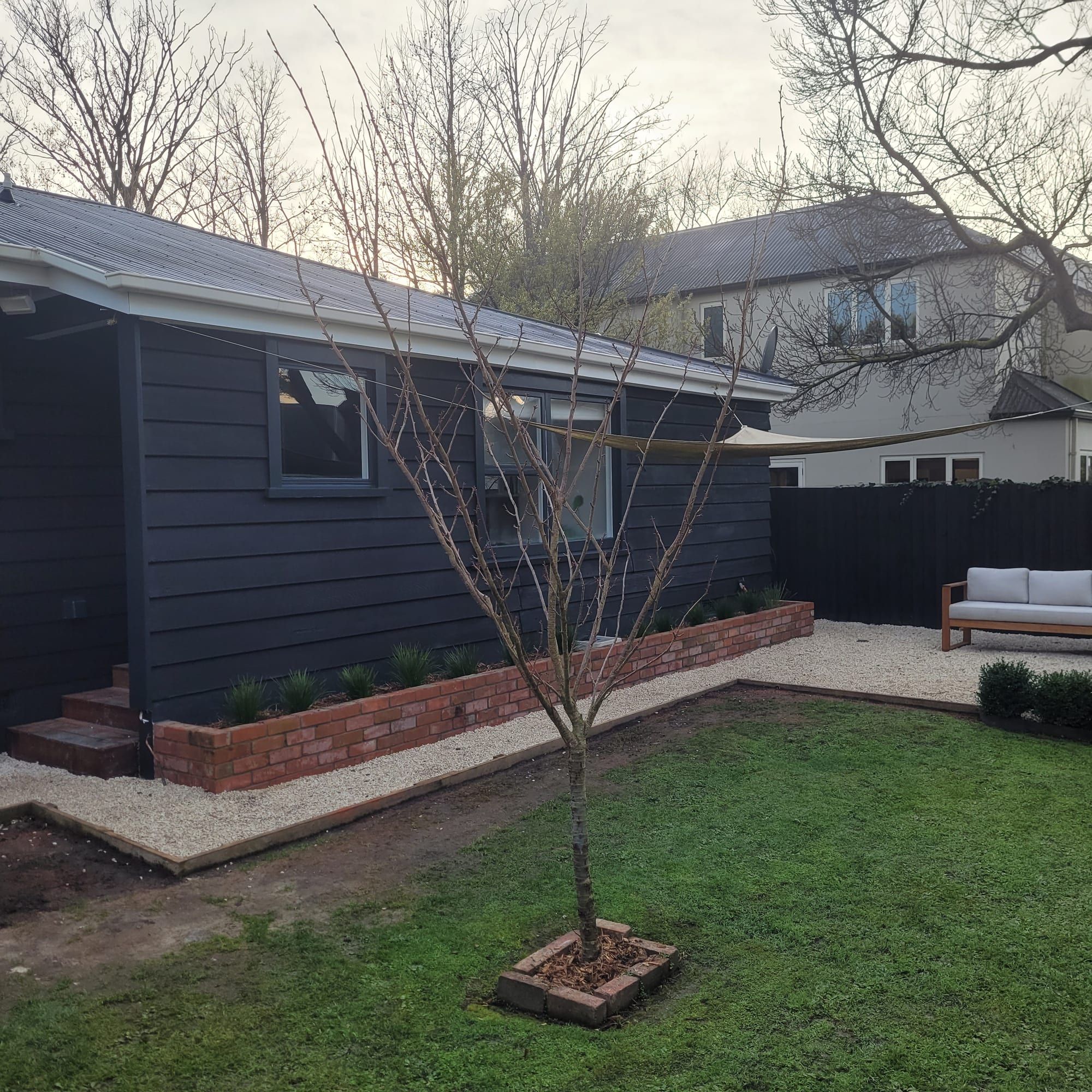 Charcoal weatherboard exterior with crisp painted lines