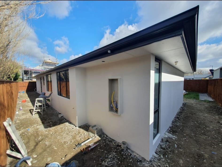 New-build exterior plastered and painted white