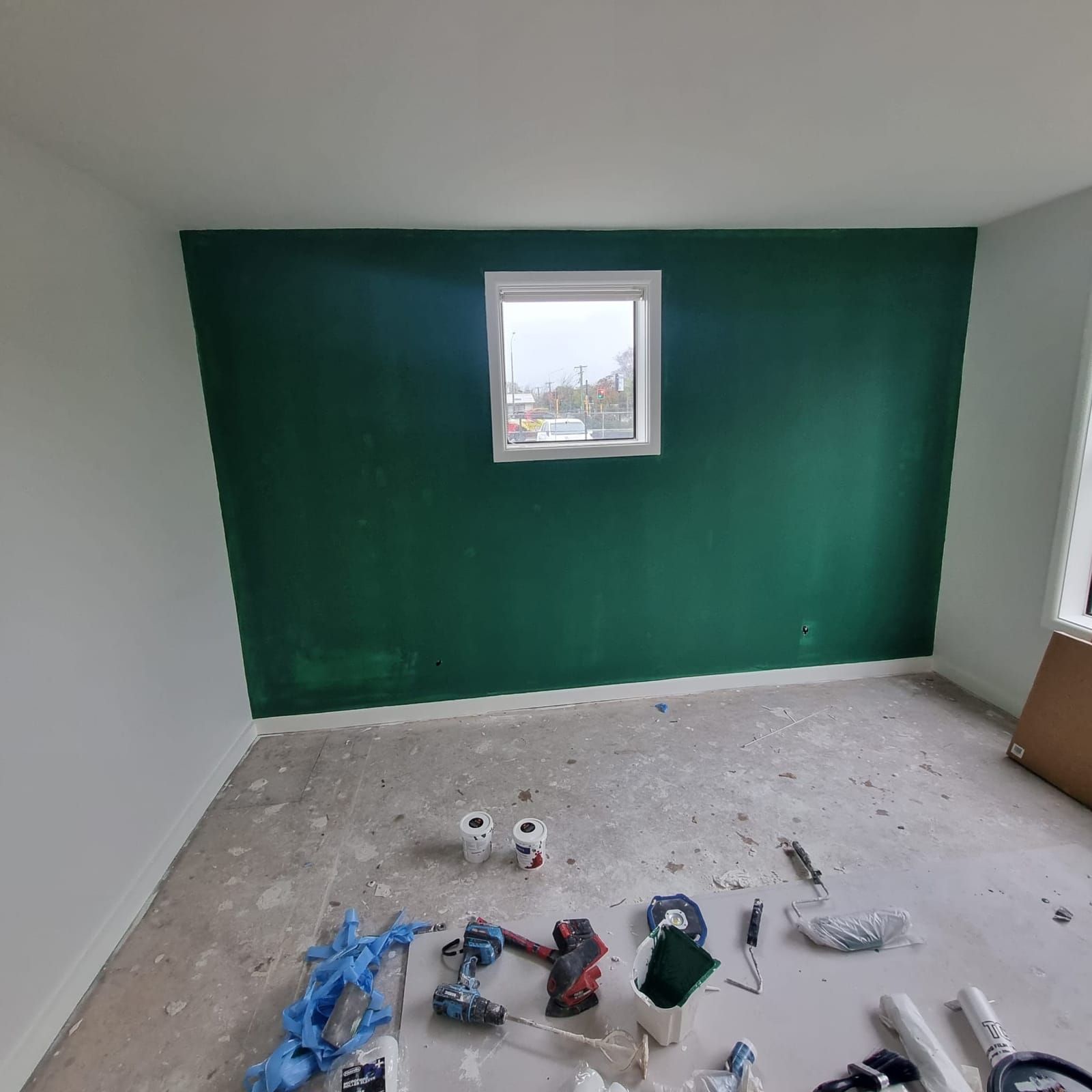 Deep green feature wall against white